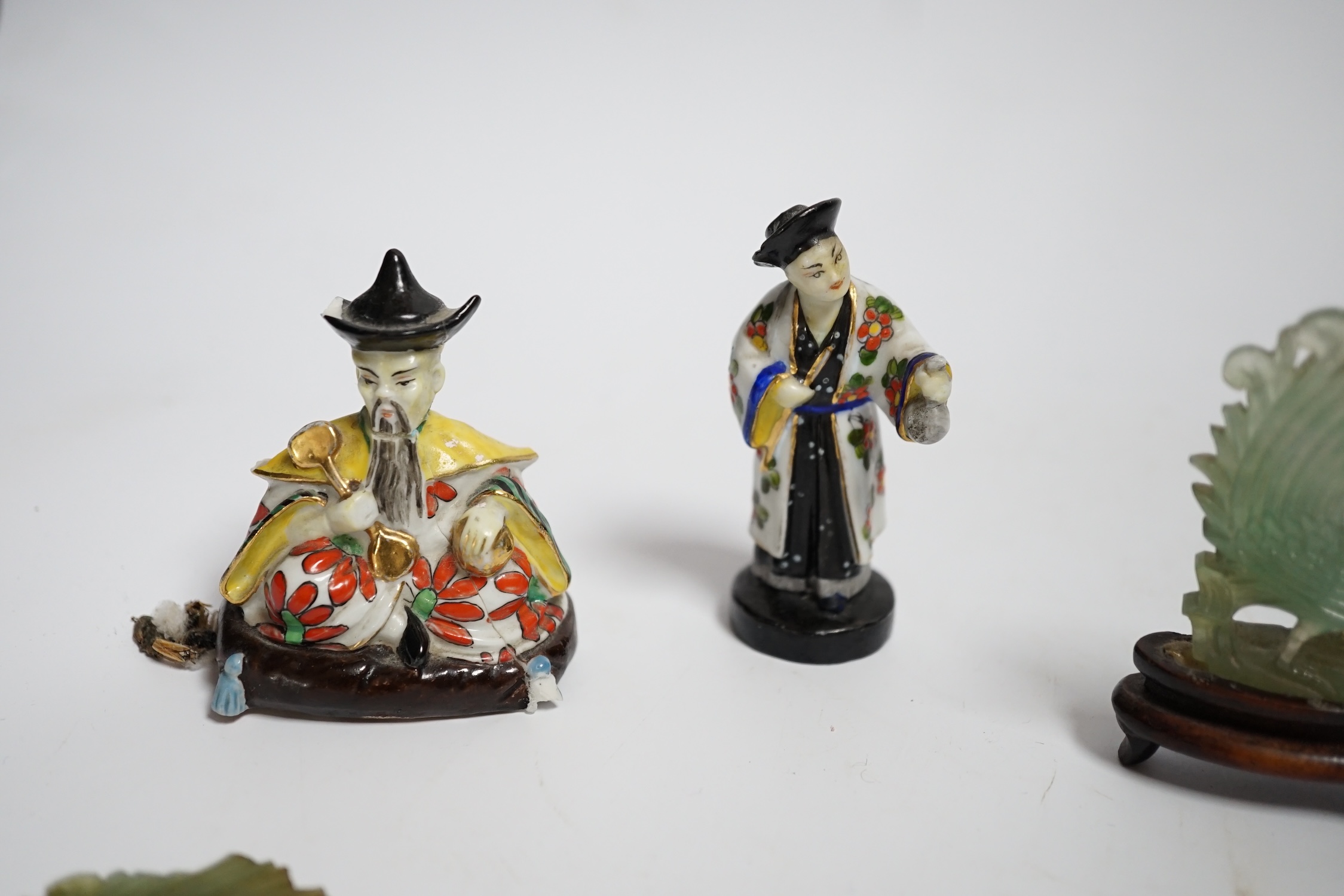 Four Chinese figures, including two jadeite examples, largest 7.5cm wide